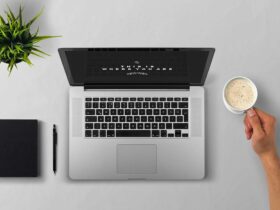 Minimalist workspace with laptop, notebook, and coffee cup representing a clutter-free digital life.