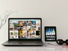 Minimalist desk setup with headphones and laptop for focus.